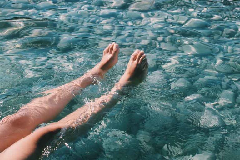 smooth legs in water symbolising aqua natural strip sugaring
